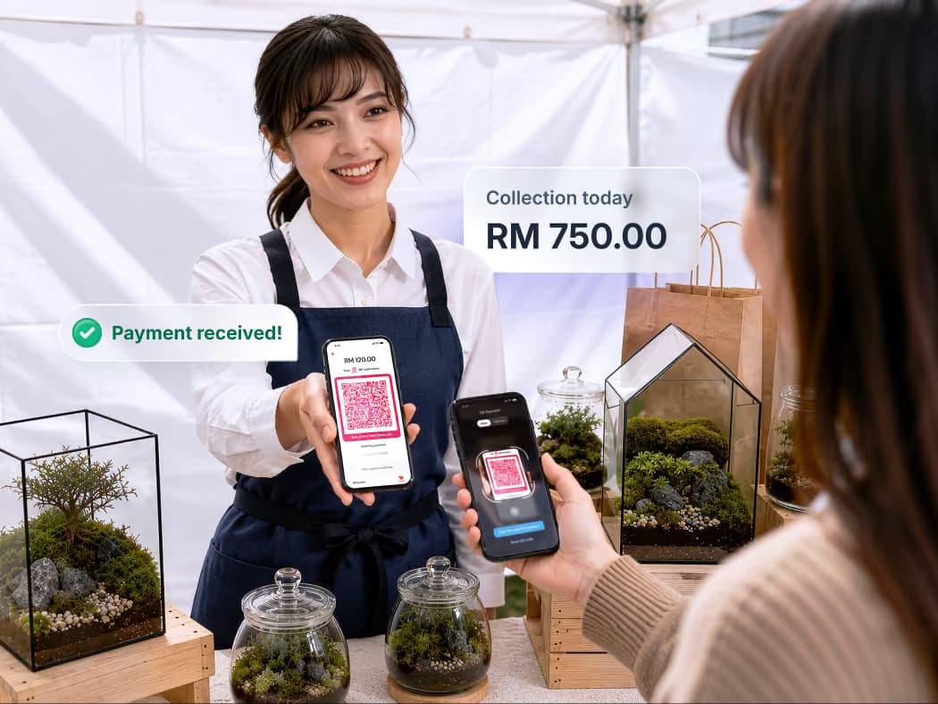 A seller at pop-up market showing her phone displaying QR to receive payments from customer.