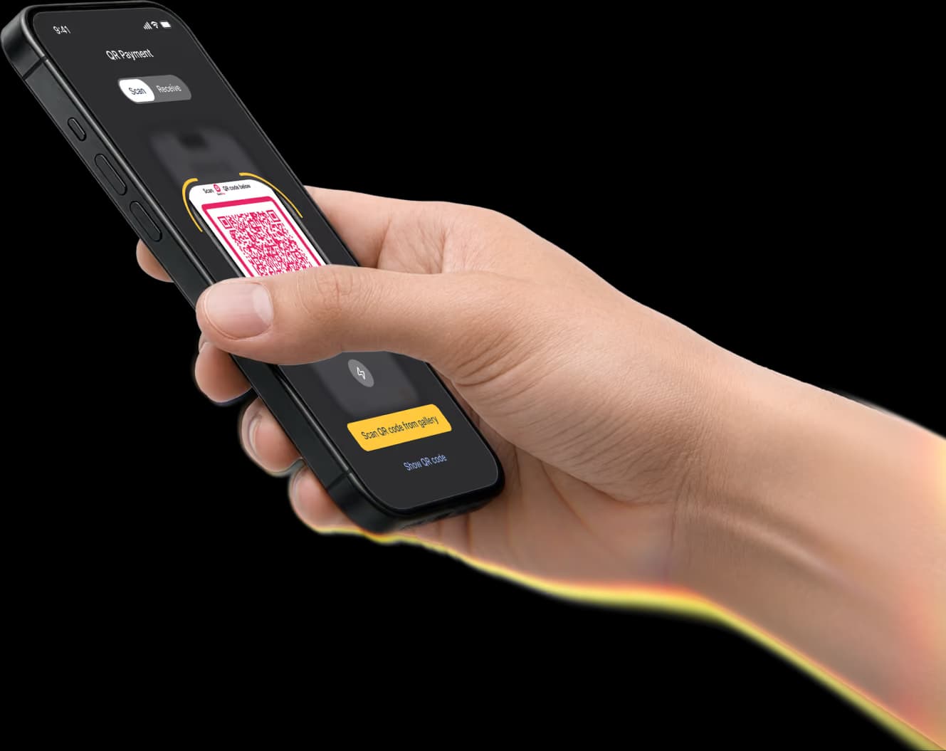Hand holding a black smartphone displaying a banking app interface scanning QR code.
